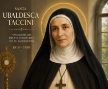 Retrato religioso de Santa Ubaldesca Taccini em estilo clássico e realista, vestindo hábito preto e branco de freira, segurando um livro religioso junto ao peito e usando crucifixo no pescoço. A santa aparece com halo dourado ao redor da cabeça, em ambiente interno iluminado suavemente por uma janela, com ostensório dourado ao fundo e atmosfera espiritual e serena
